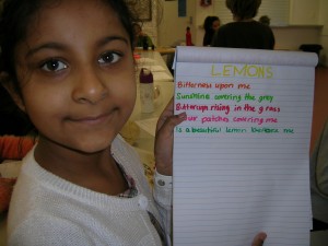 Child holding up her poem